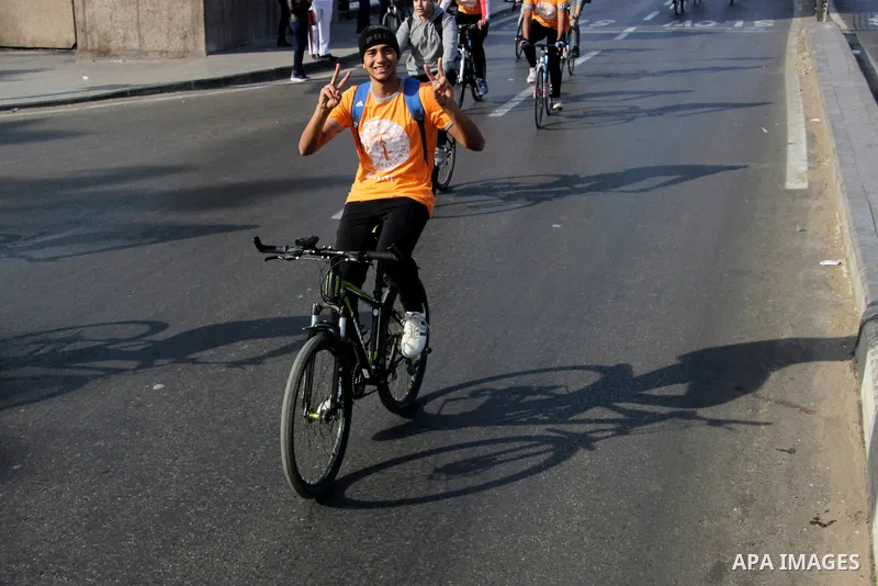 Egyptians ride their bicycles during the annual event known as 'Orange Bike Day', organized by Netherlands' Embassy to Cairo to highlight environment friendly transport, in Cairo, Egypt on November 18, 2016. Photo by Amr...