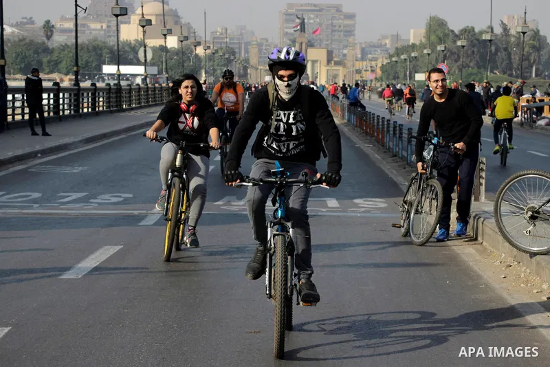 Egyptians ride their bicycles during the annual event known as 'Orange Bike Day', organized by Netherlands' Embassy to Cairo to highlight environment friendly transport, in Cairo, Egypt on November 18, 2016. Photo by Amr...