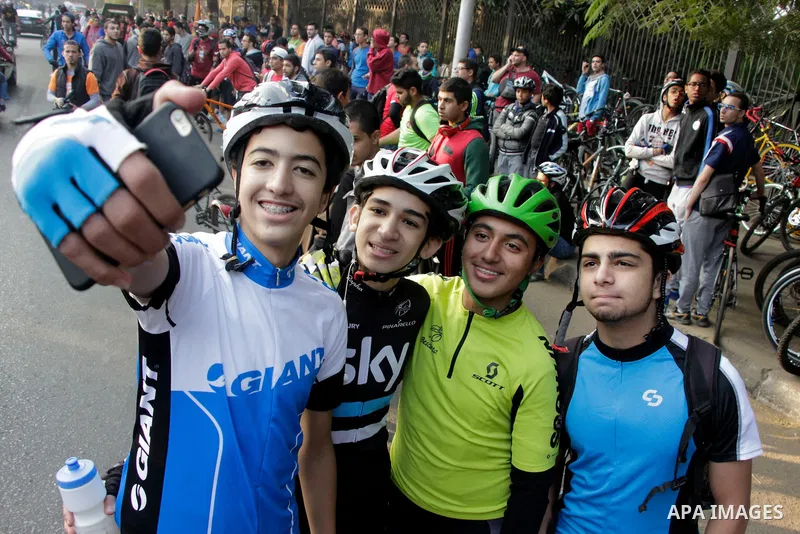 Egyptians take part during the annual event known as 'Orange Bike Day', organized by Netherlands' Embassy to Cairo to highlight environment friendly transport, in Cairo, Egypt on November 18, 2016. Photo by Amr Sayed