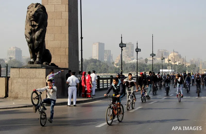 Egyptians ride their bicycles during the annual event known as 'Orange Bike Day', organized by Netherlands' Embassy to Cairo to highlight environment friendly transport, in Cairo, Egypt on November 18, 2016. Photo by Amr...