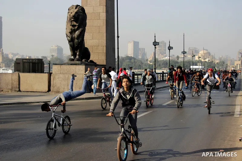 Egyptians ride their bicycles during the annual event known as 'Orange Bike Day', organized by Netherlands' Embassy to Cairo to highlight environment friendly transport, in Cairo, Egypt on November 18, 2016. Photo by Amr...
