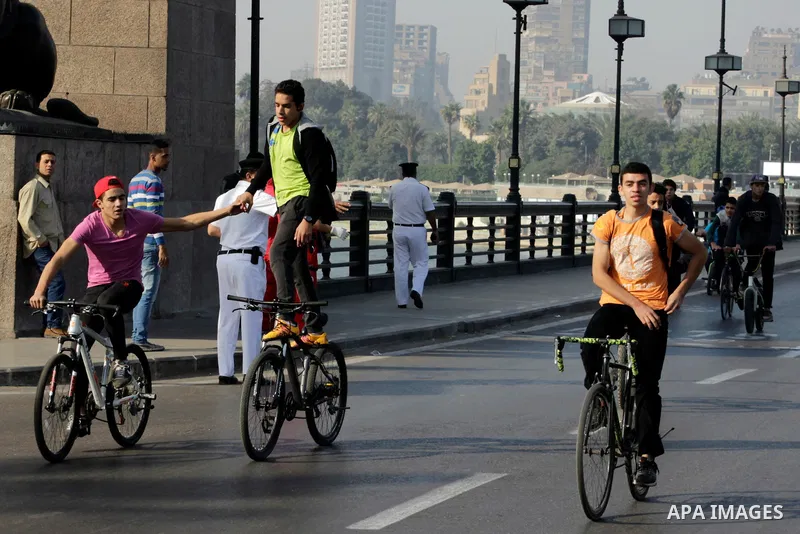 Egyptians ride their bicycles during the annual event known as 'Orange Bike Day', organized by Netherlands' Embassy to Cairo to highlight environment friendly transport, in Cairo, Egypt on November 18, 2016. Photo by Amr...
