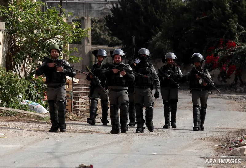 Israeli border policemen take position during clashes with Palestinian protesters following a demonstration against the expropriation of Palestinian land by Israel on November 18, 2016 in the village of Kfar Qaddum, near...