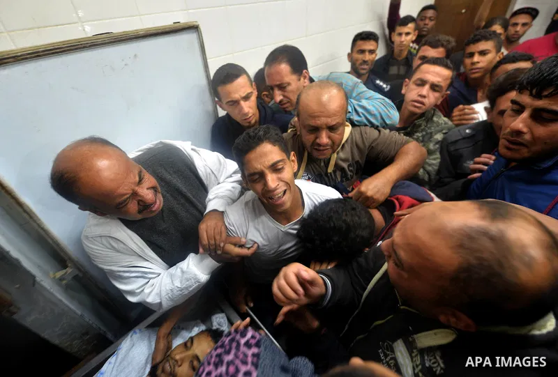 Relatives react after seeing the body of Mohammed Abu Saada, a 26-year-old Palestinian man who was reportedly killed in clashes with the Israeli army along the Gaza border, at a morgue in Deir al-Balah in central Gaza on...