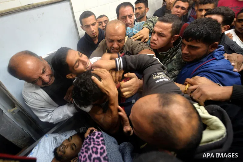 Relatives react after seeing the body of Mohammed Abu Saada, a 26-year-old Palestinian man who was reportedly killed in clashes with the Israeli army along the Gaza border, at a morgue in Deir al-Balah in central Gaza on...