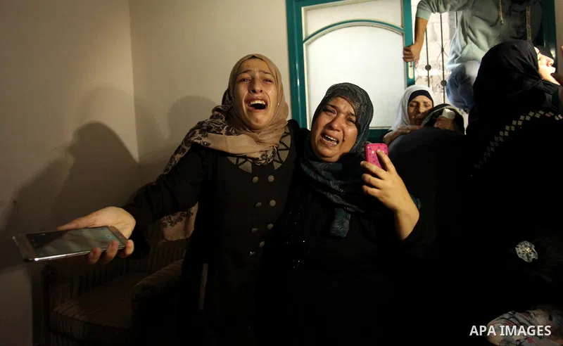 Relatives of Mohammed Abu Saada, a 26-year-old Palestinian man who was reportedly killed in clashes with the Israeli army along the Gaza border, mourn during his funeral in the Nuseirat refugee camp in the central Gaza S...