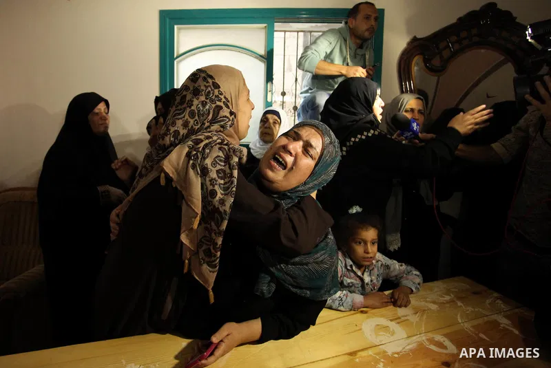 Relatives of Mohammed Abu Saada, a 26-year-old Palestinian man who was reportedly killed in clashes with the Israeli army along the Gaza border, mourn during his funeral in the Nuseirat refugee camp in the central Gaza S...