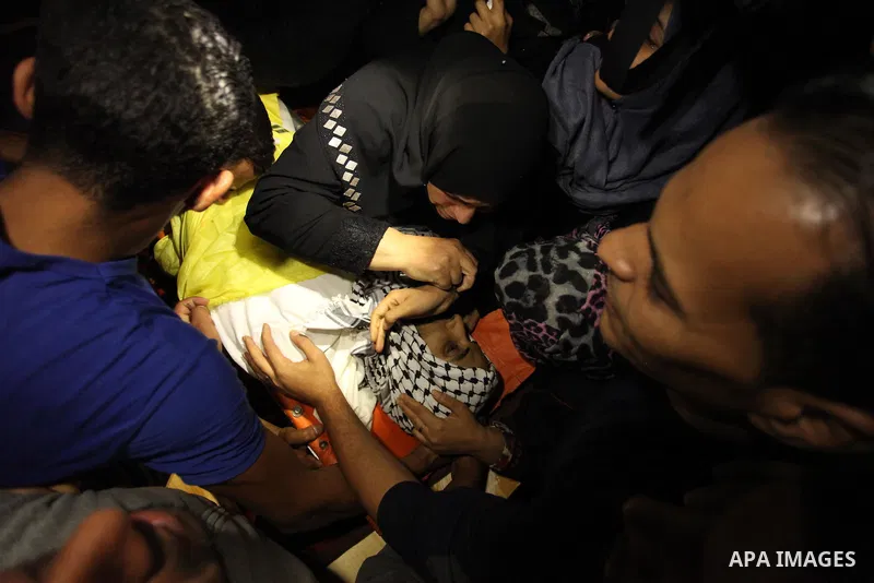 Relatives of Mohammed Abu Saada, a 26-year-old Palestinian man who was reportedly killed in clashes with the Israeli army along the Gaza border, mourn during his funeral in the Nuseirat refugee camp in the central Gaza S...