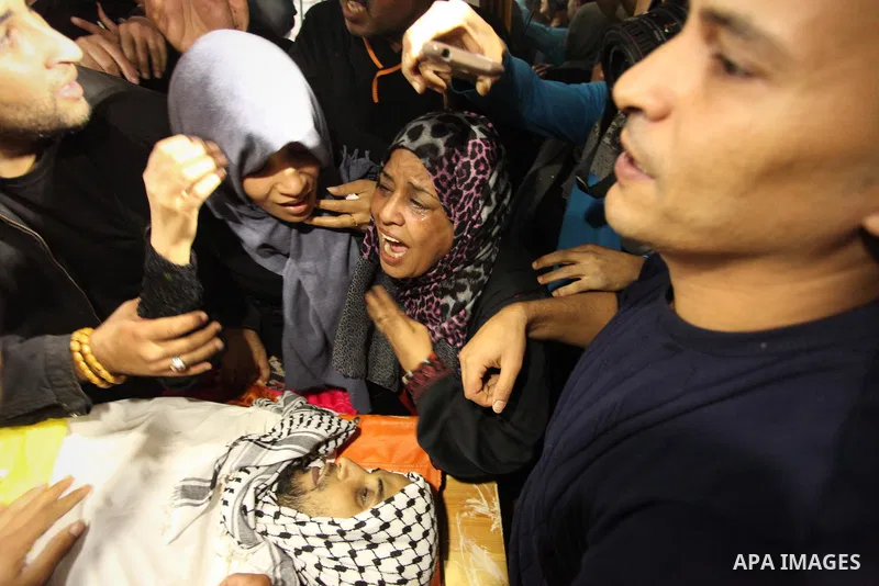 The Palestinian mother of Mohammed Abu Saada, a 26-year-old Palestinian man who was reportedly killed in clashes with the Israeli army along the Gaza border, mourns during his funeral in the Nuseirat refugee camp in the...