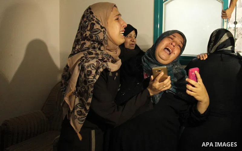 Relatives of Mohammed Abu Saada, a 26-year-old Palestinian man who was reportedly killed in clashes with the Israeli army along the Gaza border, mourn during his funeral in the Nuseirat refugee camp in the central Gaza S...
