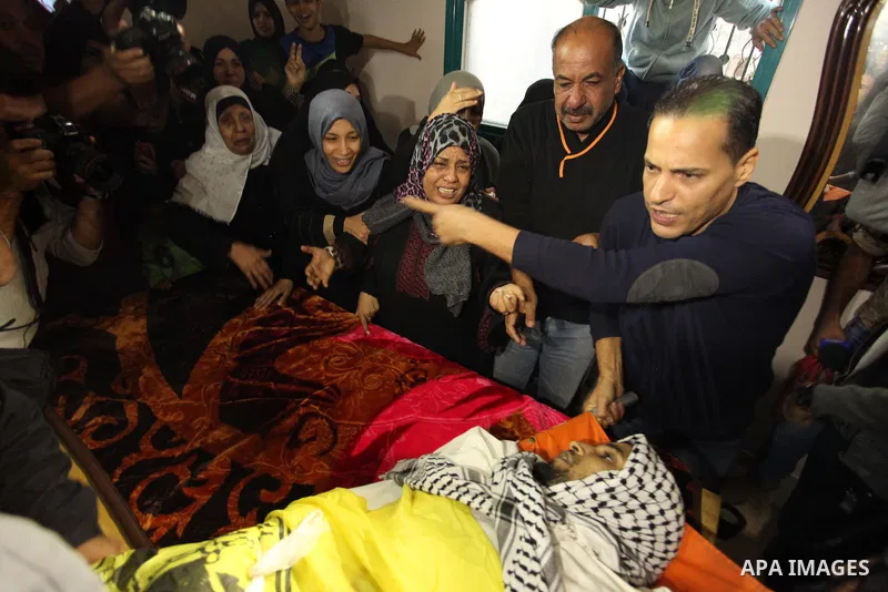 Relatives of Mohammed Abu Saada, a 26-year-old Palestinian man who was reportedly killed in clashes with the Israeli army along the Gaza border, mourn during his funeral in the Nuseirat refugee camp in the central Gaza S...