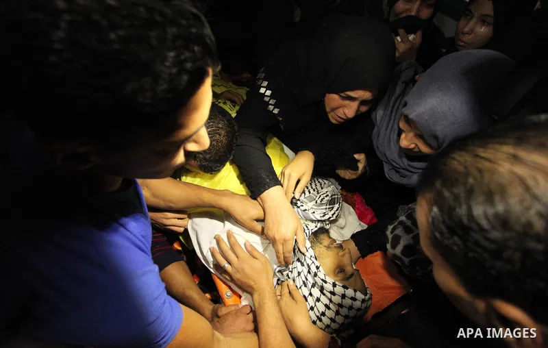 Relatives of Mohammed Abu Saada, a 26-year-old Palestinian man who was reportedly killed in clashes with the Israeli army along the Gaza border, mourn during his funeral in the Nuseirat refugee camp in the central Gaza S...