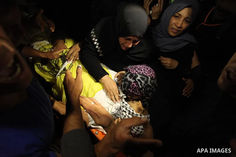 Relatives of Mohammed Abu Saada, a 26-year-old Palestinian man who was reportedly killed in clashes with the Israeli army along the Gaza border, mourn during his funeral in the Nuseirat refugee camp in the central Gaza S...