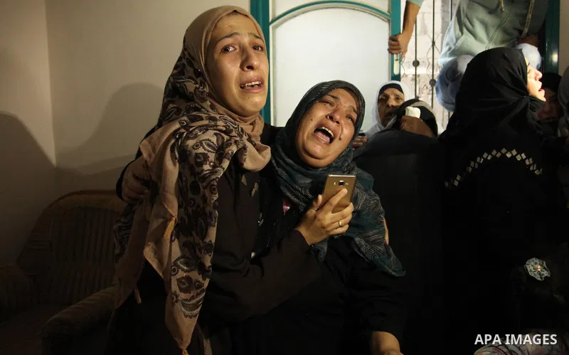 Relatives of Mohammed Abu Saada, a 26-year-old Palestinian man who was reportedly killed in clashes with the Israeli army along the Gaza border, mourn during his funeral in the Nuseirat refugee camp in the central Gaza S...