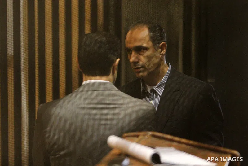 Alaa and Gamal Mubarak, the sons of former former president Hosni Mubarak sit in a courtroom cage during their trial on November 19, 2016. Cairo Criminal Court held at Police Academy adjourned Gamal and Alaa Mubarak tria...