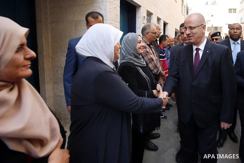 Palestinian Prime Minister Rami Hamdallah attends international campaign against violence against women, in the West Bank city of Tulkarem, on Nov. 20, 2016. Photo by Prime Minister Office