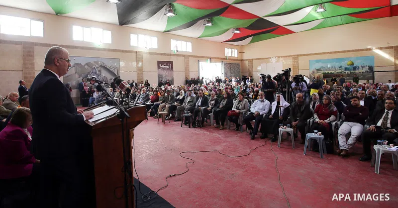 Palestinian Prime Minister Rami Hamdallah speaks during international campaign against violence against women, in the West Bank city of Tulkarem, on Nov. 20, 2016. Photo by Prime Minister Office