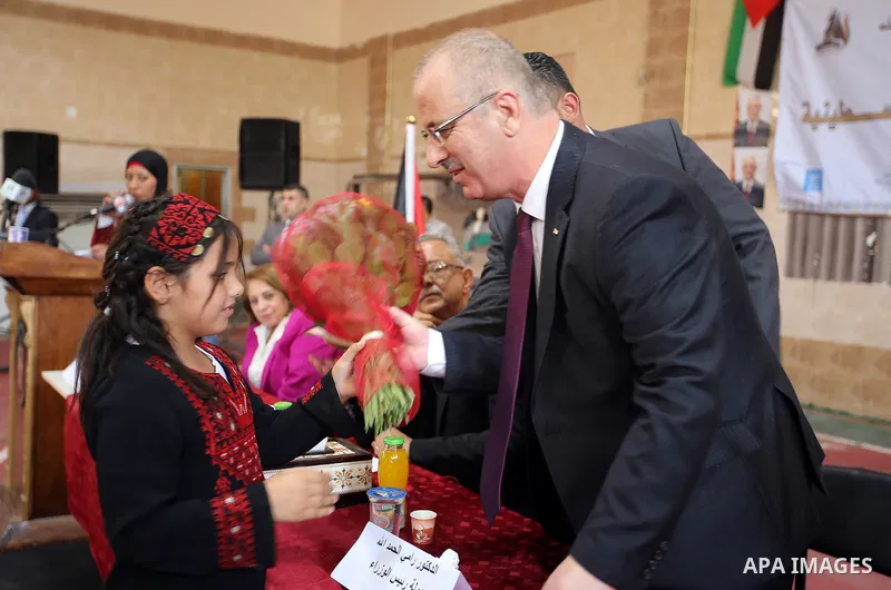 Palestinian Prime Minister Rami Hamdallah attends international campaign against violence against women, in the West Bank city of Tulkarem, on Nov. 20, 2016. Photo by Prime Minister Office