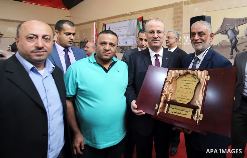 Palestinian Prime Minister Rami Hamdallah attends international campaign against violence against women, in the West Bank city of Tulkarem, on Nov. 20, 2016. Photo by Prime Minister Office