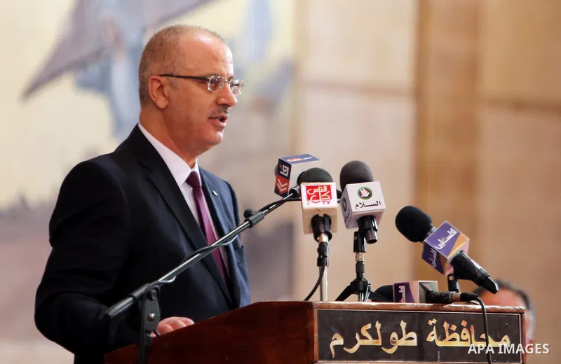 Palestinian Prime Minister Rami Hamdallah speaks during international campaign against violence against women, in the West Bank city of Tulkarem, on Nov. 20, 2016. Photo by Prime Minister Office