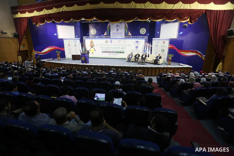 Palestinians take part during technology exhibition funded by Islamic Development Bank in Jeddah, at the Islamic University in Gaza city, on Nov. 20, 2016. Photo by Mohammed Asad