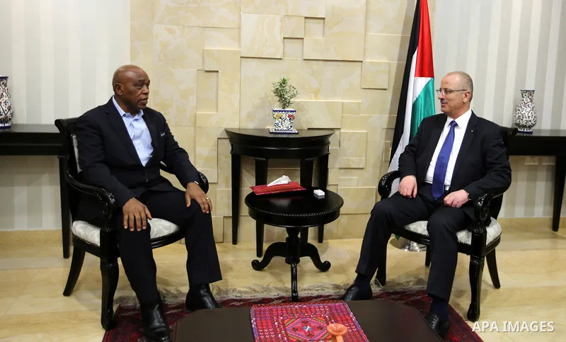 Palestinian Prime Minister Rami Hamdallah meets with Head of FIFA's monitoring mission on the Israel-Palestinian issue of football, South Africa's Tokyo Sexwale, in the West Bank city of Ramallah on Nov. 22, 2016. Photo...