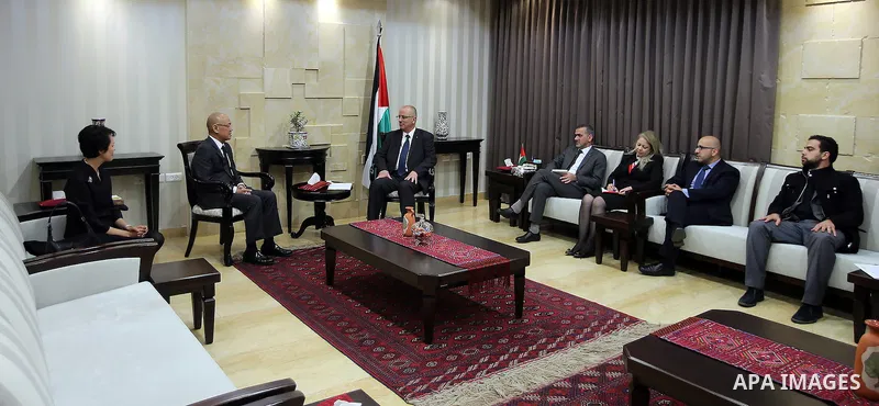 Palestinian Prime Minister Rami Hamdallah meets with Thailand's Ambassador to the United Nations Virachai Plasai, in the West Bank city of Ramallah, on November 23, 2016. Photo by Prime Minister Office