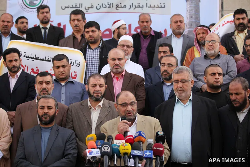 Palestinians hold banners during a protest against a controversial Israeli bill to limit the volume of calls to prayer at mosques in the occupied Jerusalem, in Gaza city on November 23, 2016. Israeli Prime Minister Benja...