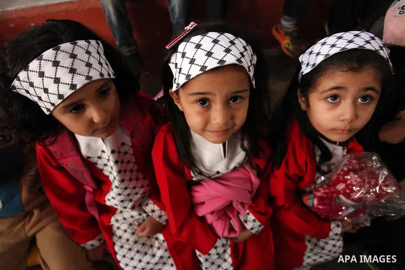 Palestinian children play during an entertaining day to mark the UN Universal Children's Day in Gaza City on November 23, 2016. Photo by Ashraf Amra