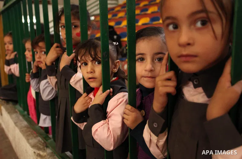 Palestinian children play during an entertaining day to mark the UN Universal Children's Day in Gaza City on November 23, 2016. Photo by Ashraf Amra