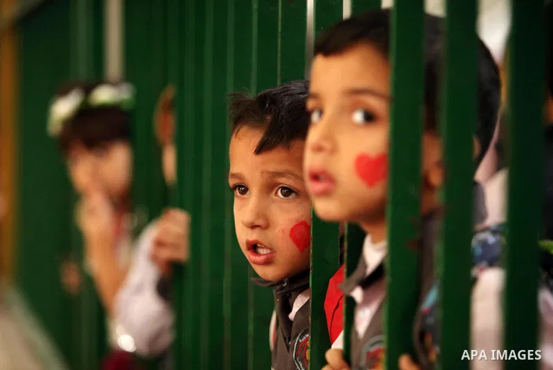 Palestinian children play during an entertaining day to mark the UN Universal Children's Day in Gaza City on November 23, 2016. Photo by Ashraf Amra