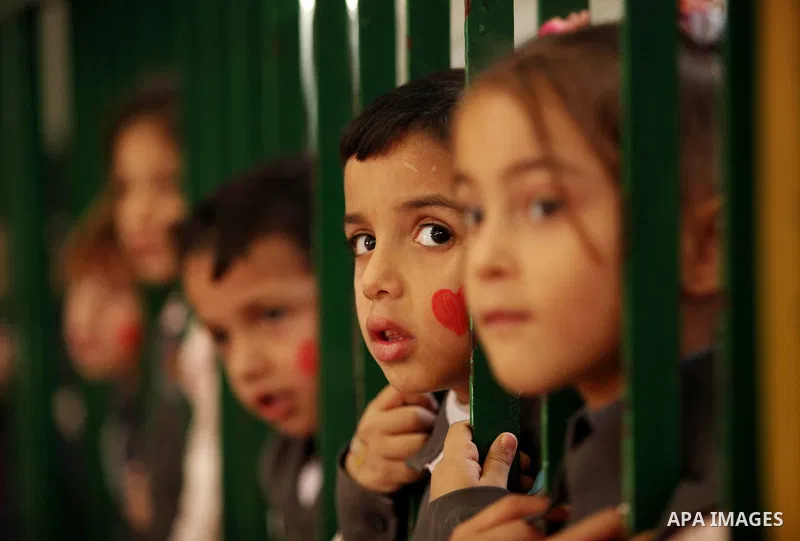 Palestinian children play during an entertaining day to mark the UN Universal Children's Day in Gaza City on November 23, 2016. Photo by Ashraf Amra