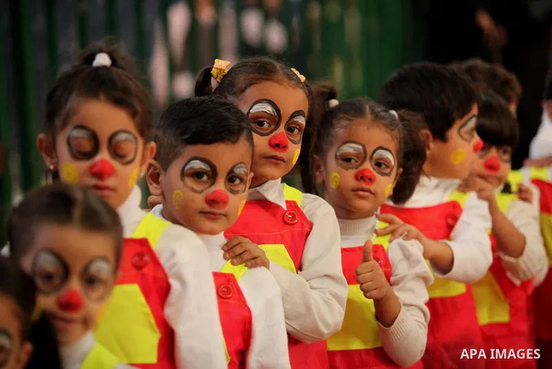 Palestinian children play during an entertaining day to mark the UN Universal Children's Day in Gaza City on November 23, 2016. Photo by Ashraf Amra