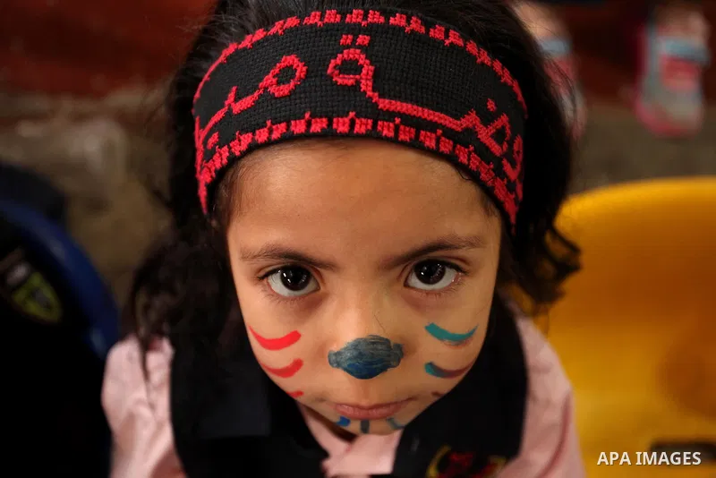 Palestinian children play during an entertaining day to mark the UN Universal Children's Day in Gaza City on November 23, 2016. Photo by Ashraf Amra
