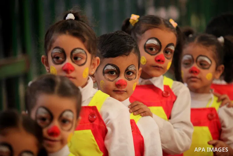 Palestinian children play during an entertaining day to mark the UN Universal Children's Day in Gaza City on November 23, 2016. Photo by Ashraf Amra