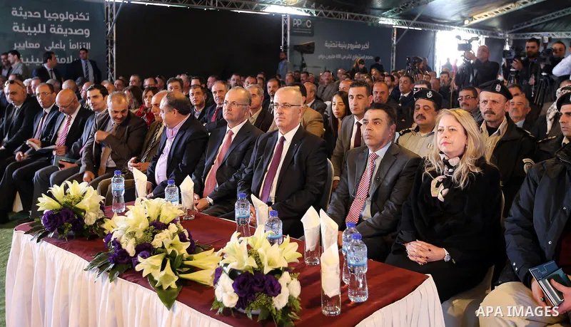 Palestinian Prime Minister Rami Hamdallah attends a ceremony of laying the foundation stone of the Jenin power plant, in the West Bank city of Jenin, on Nov. 24, 2016. Photo by Prime Minister Office