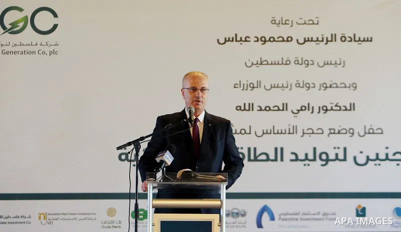 Palestinian Prime Minister Rami Hamdallah speaks during a ceremony of laying the foundation stone of the Jenin power plant, in the West Bank city of Jenin, on Nov. 24, 2016. Photo by Prime Minister Office