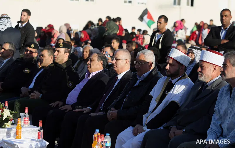 Palestinian Prime Minister Rami Hamdallah attends a mass wedding ceremony supported by Palestinian President Mahmoud Abbas, in the West Bank city of Jenin on Nov. 24, 2016. Photo by Prime Minister Office
