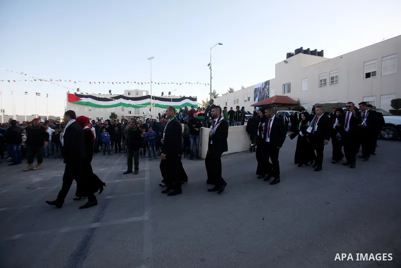Palestinian brides and grooms take part in a mass wedding ceremony for 27 couples, supported by Palestinian President Mahmoud Abbas in the West Bank city of Jenin November 24, 2016. Photo by Nedal Eshtayah