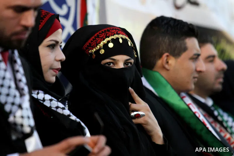 Palestinian brides and grooms take part in a mass wedding ceremony for 27 couples, supported by Palestinian President Mahmoud Abbas in the West Bank city of Jenin November 24, 2016. Photo by Nedal Eshtayah