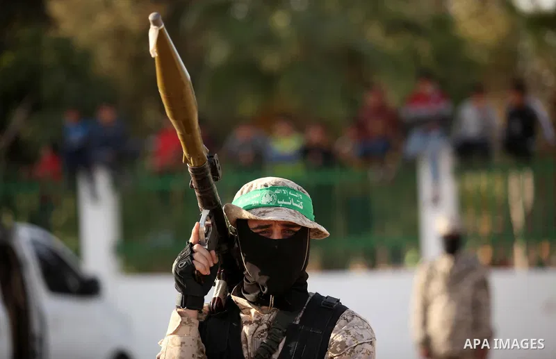 Palestinian militants of the Hamas movement take part in a rally in Gaza city on November 25, 2016. Photo by Ashraf Amra