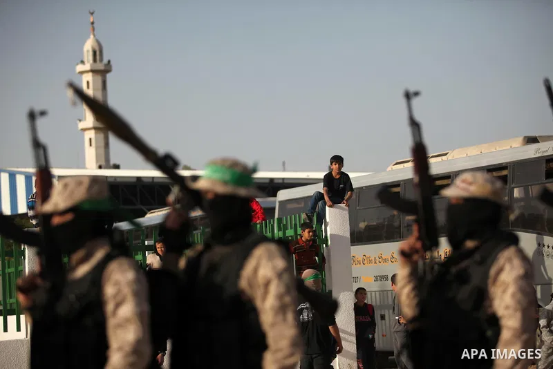 Palestinian militants of the Hamas movement take part in a rally in Gaza city on November 25, 2016. Photo by Ashraf Amra