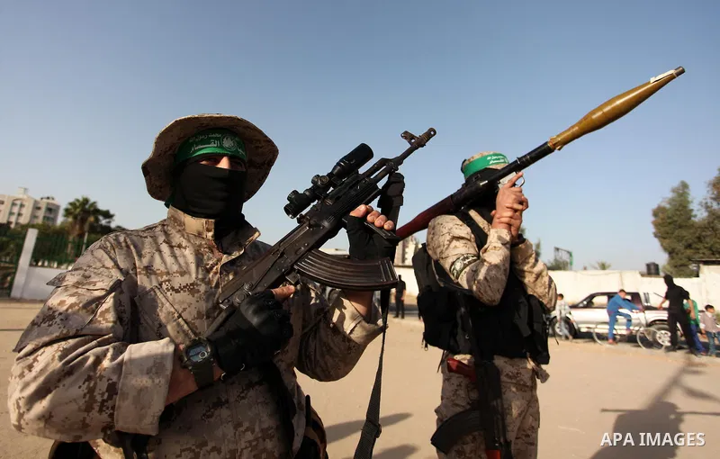 Palestinian militants of the Hamas movement take part in a rally in Gaza city on November 25, 2016. Photo by Ashraf Amra