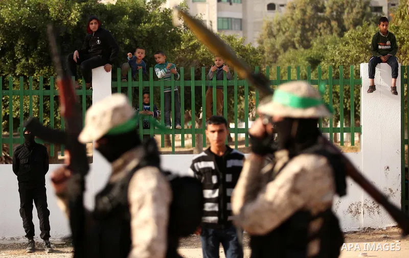 Palestinian militants of the Hamas movement take part in a rally in Gaza city on November 25, 2016. Photo by Ashraf Amra