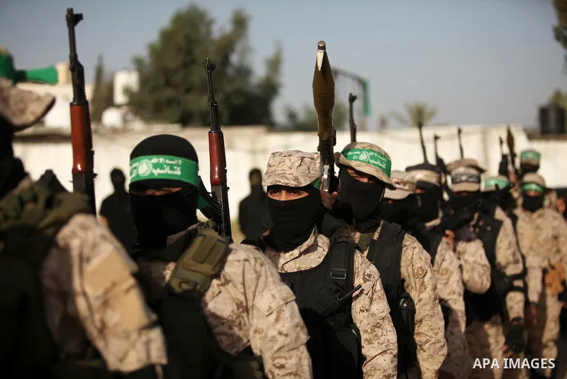 Palestinian militants of the Hamas movement take part in a rally in Gaza city on November 25, 2016. Photo by Ashraf Amra