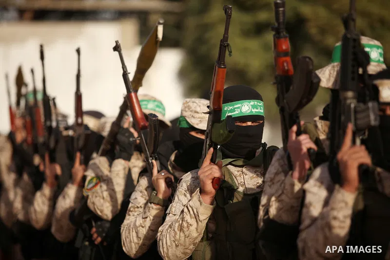 Palestinian militants of the Hamas movement take part in a rally in Gaza city on November 25, 2016. Photo by Ashraf Amra
