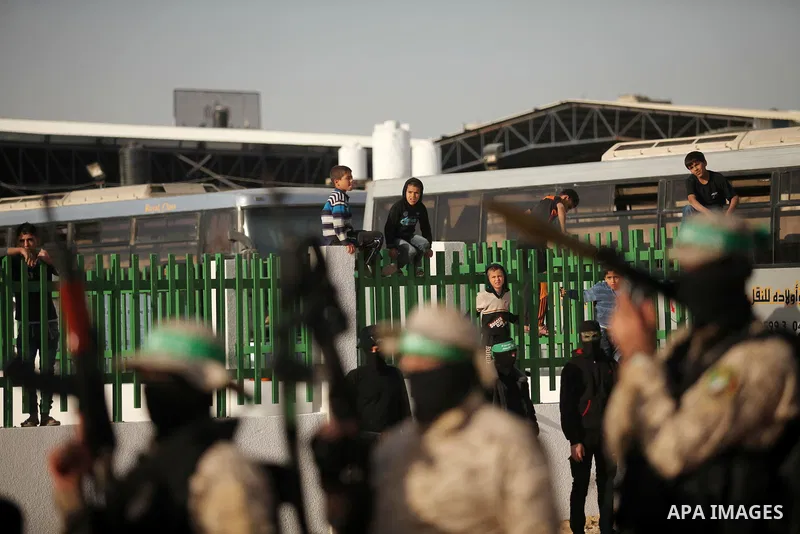 Palestinian militants of the Hamas movement take part in a rally in Gaza city on November 25, 2016. Photo by Ashraf Amra