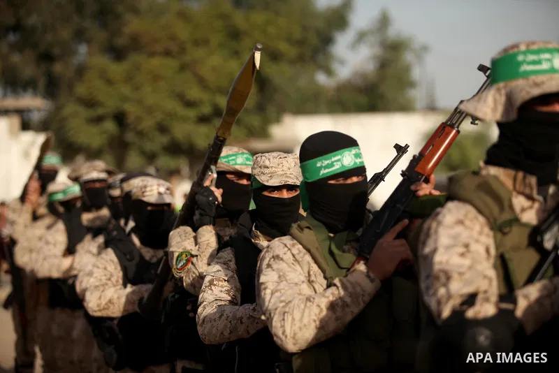 Palestinian militants of the Hamas movement take part in a rally in Gaza city on November 25, 2016. Photo by Ashraf Amra