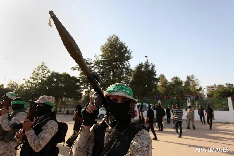 Palestinian militants of the Hamas movement take part in a rally in Gaza city on November 25, 2016. Photo by Ashraf Amra