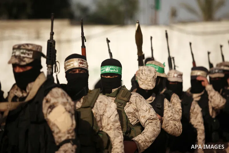 Palestinian militants of the Hamas movement take part in a rally in Gaza city on November 25, 2016. Photo by Ashraf Amra